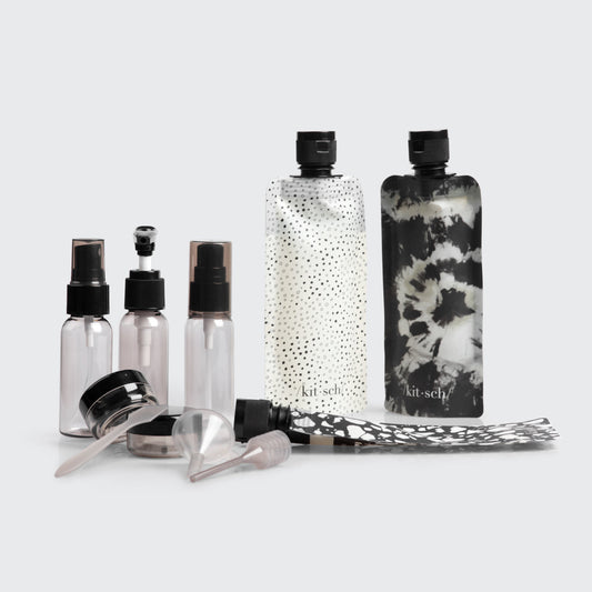 Kitsch Ultimate Travel Bottles 11pc Set in Black & Ivory shown packed in toiletry bag