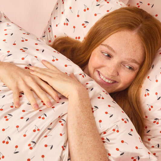 Model sleeping on KITSCH Cherry Print King Satin Pillowcase