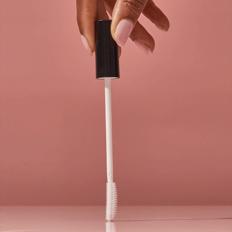 KITSCH Styling Taming Wand — animated product shot showing wand and packaging — Lightweight, clear formula smoothes strands without stickiness or white residue — compact packaging makes it easy to style on the go