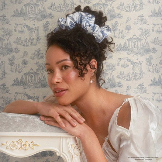KITSCH Bridgerton x Kitsch Satin Pillow Scrunchies® in Toile in Bloom — model wearing Toile in Bloom satin pillow scrunchie — silky satin construction won't crimp or damage hair overnight