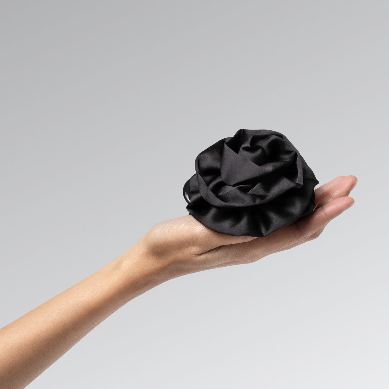 KITSCH Satin Rosette Flat Cloud Clip Black Medium — model hair shot 2