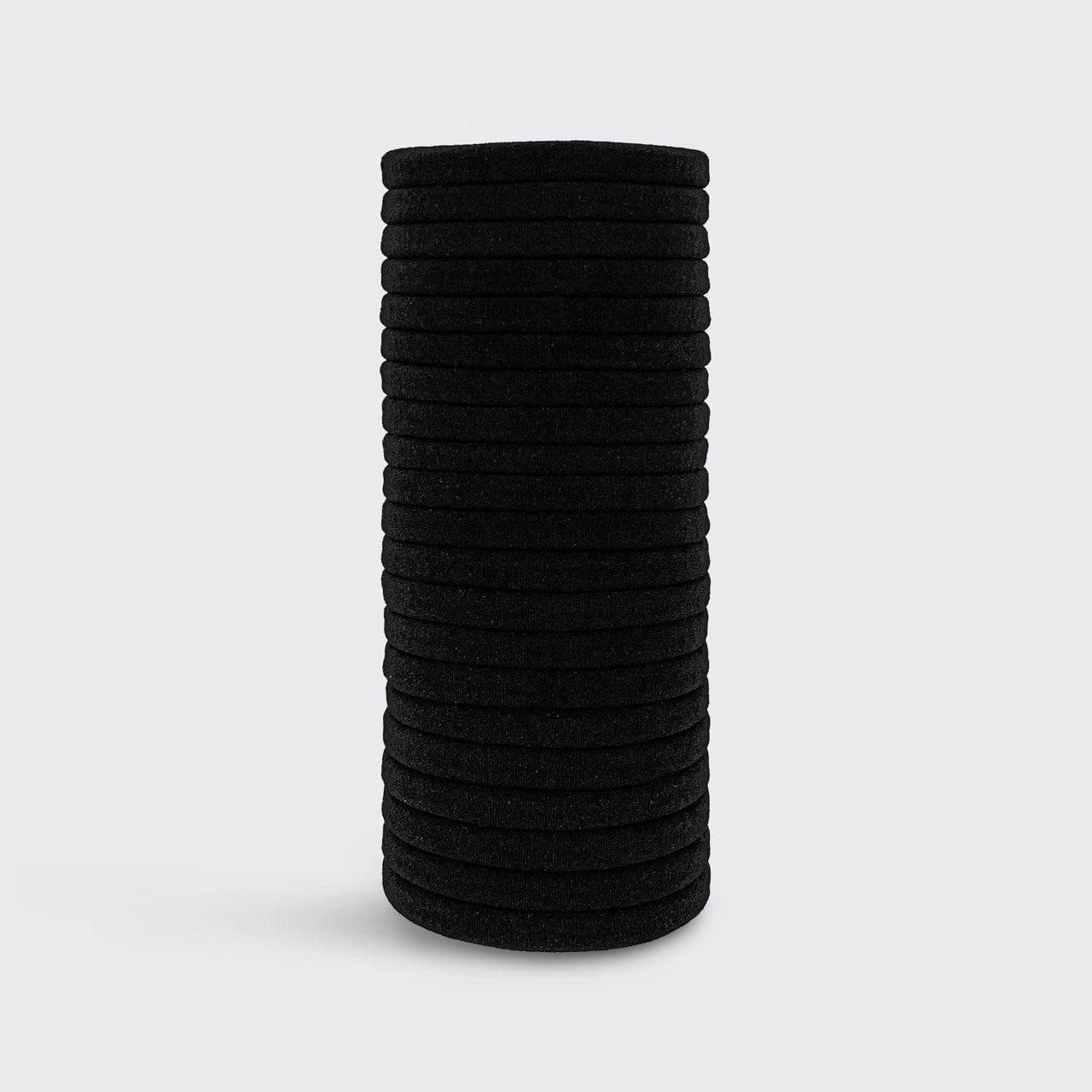 KITSCH Black Elastic Hair Ties 20pc Set — product lifestyle shot showing pack of 20 in black — consciously created from recycled materials — glide gently through hair for a tight all-day hold