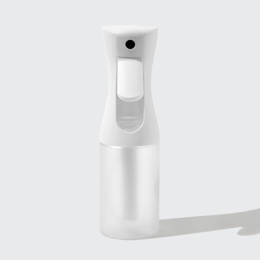 Model using White Continuous Spray to mist hair showing fine mist output