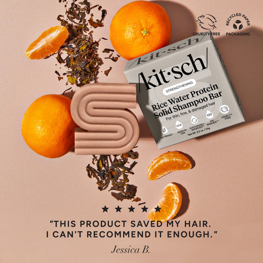 Kitsch Rice Water Shampoo Bar styled with oranges and tea leaves with five-star customer review - bio-based solid shampoo bar with Rice Tein NPNF clinically proven to increase hair volume by 20% after 5 washes. For thin, fine, and damaged hair. Cruelty-free, recycled paper packaging, made in USA, 100 washes, 3.2 oz / 91g.