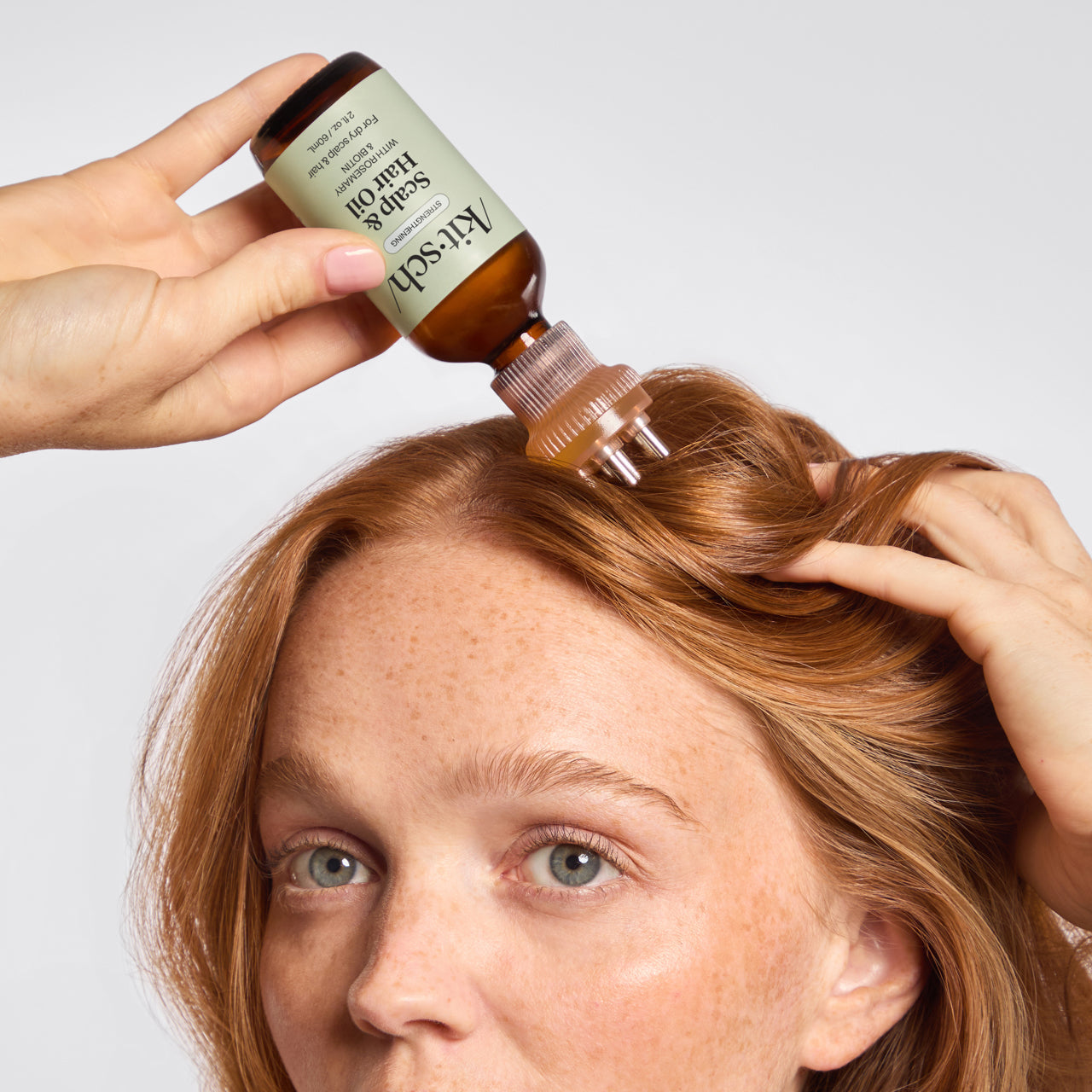 KITSCH Scalp Oil Applicator + Biotin Oil Bundle — model using scalp oil applicator — Delivers the perfect amount of product directly to your scalp and roots — lavender scent invites you to relax & indulge in an at-home spa moment