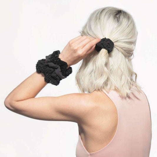 KITSCH Assorted Textured Scrunchies in Black — lifestyle product shot — 5-piece set of mixed-texture scrunchies in rich black tones — gentle on strands