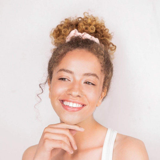 KITSCH Satin Sleep Scrunchies in Blush — blush pink satin sleep scrunchie on neutral background — gentle snag-free hold for all hair types