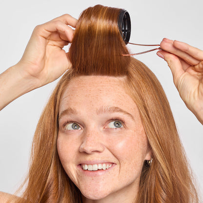 Model using Hair By Chrissy x Kitsch Ceramic Thermal Rollers to create bouncy, voluminous waves at home
