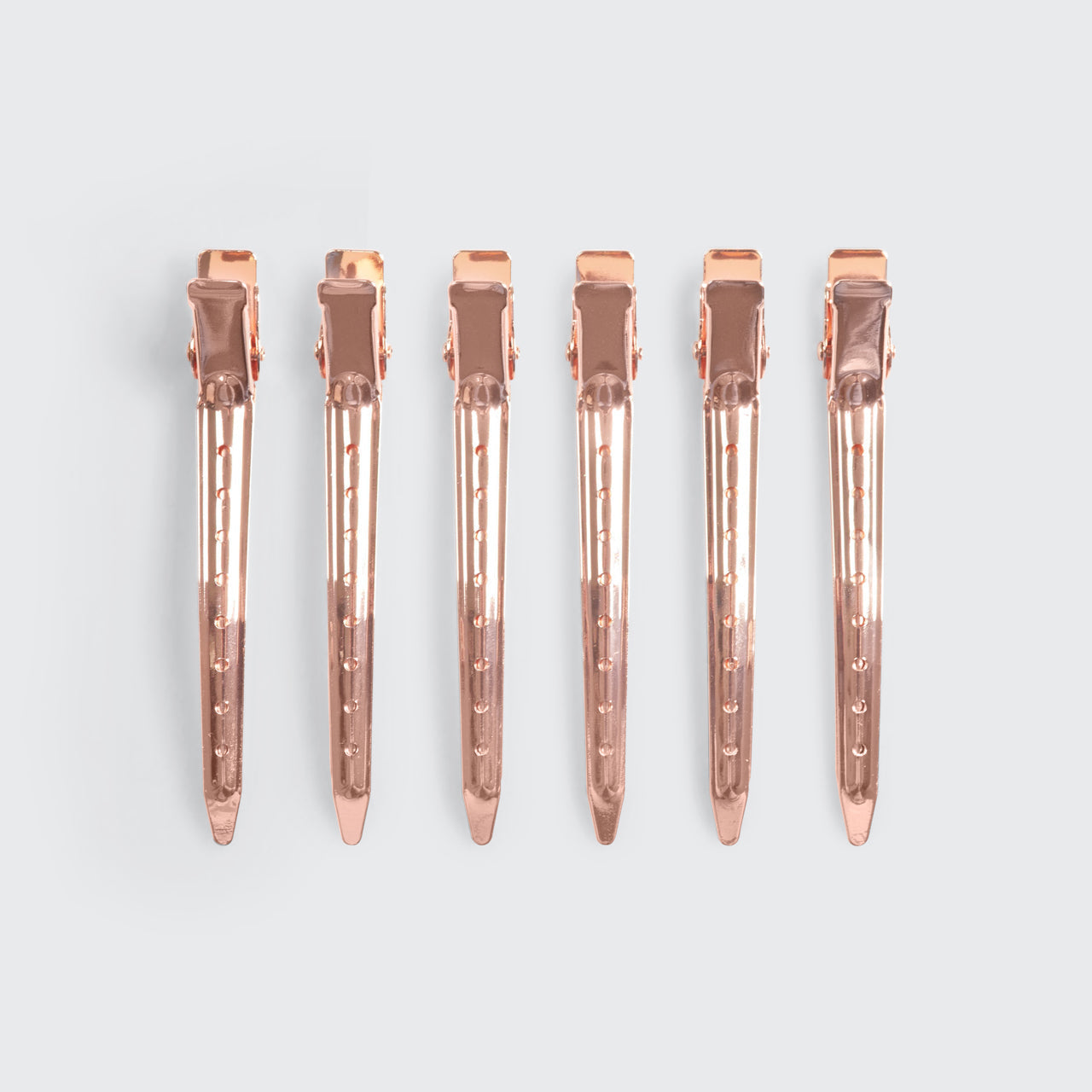 Kitsch Hair Rollers and Styling Clips Bundle styled with hair-care props on a warm background