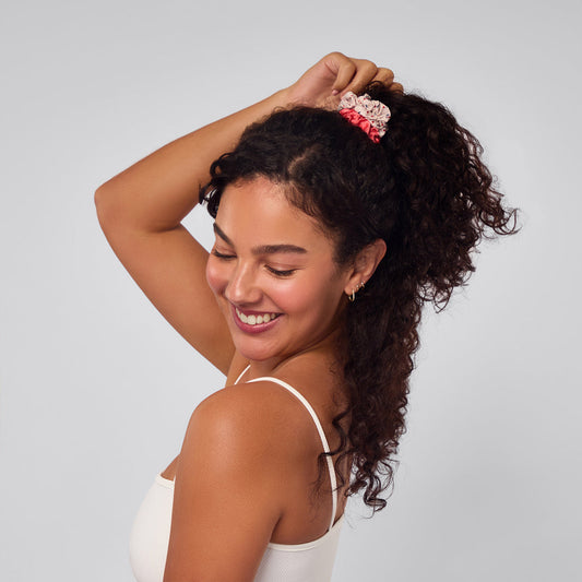 KITSCH Cherry Blossom Ruched Satin Scrunchies 5pc Set — model wearing cherry blossom ruched satin scrunchie — silky ruched satin in soft pink cherry blossom tones