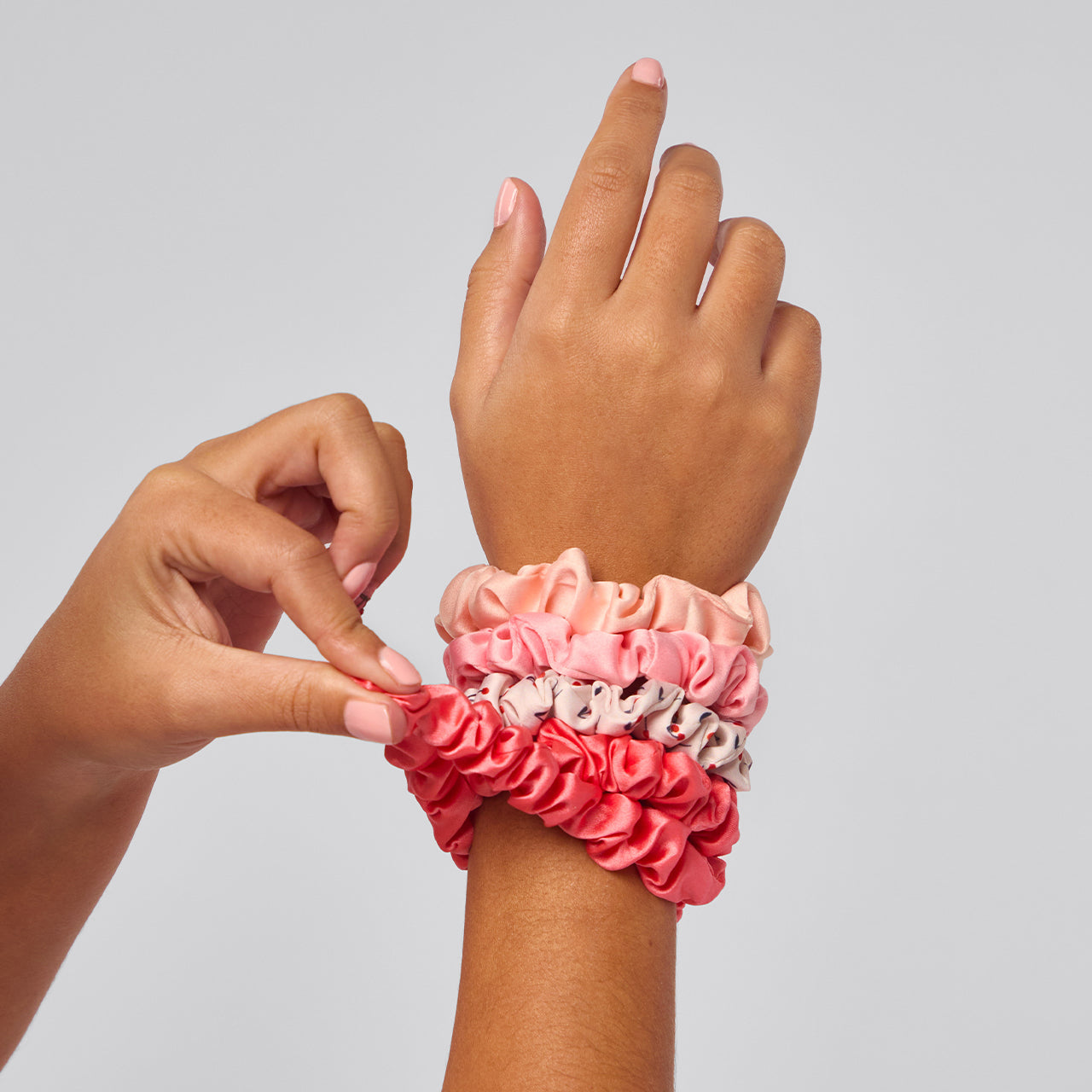 KITSCH Cherry Blossom Ruched Satin Scrunchies 5pc Set — model with cherry blossom ruched satin scrunchie in updo — 5pc set in soft pink and cherry blossom tones