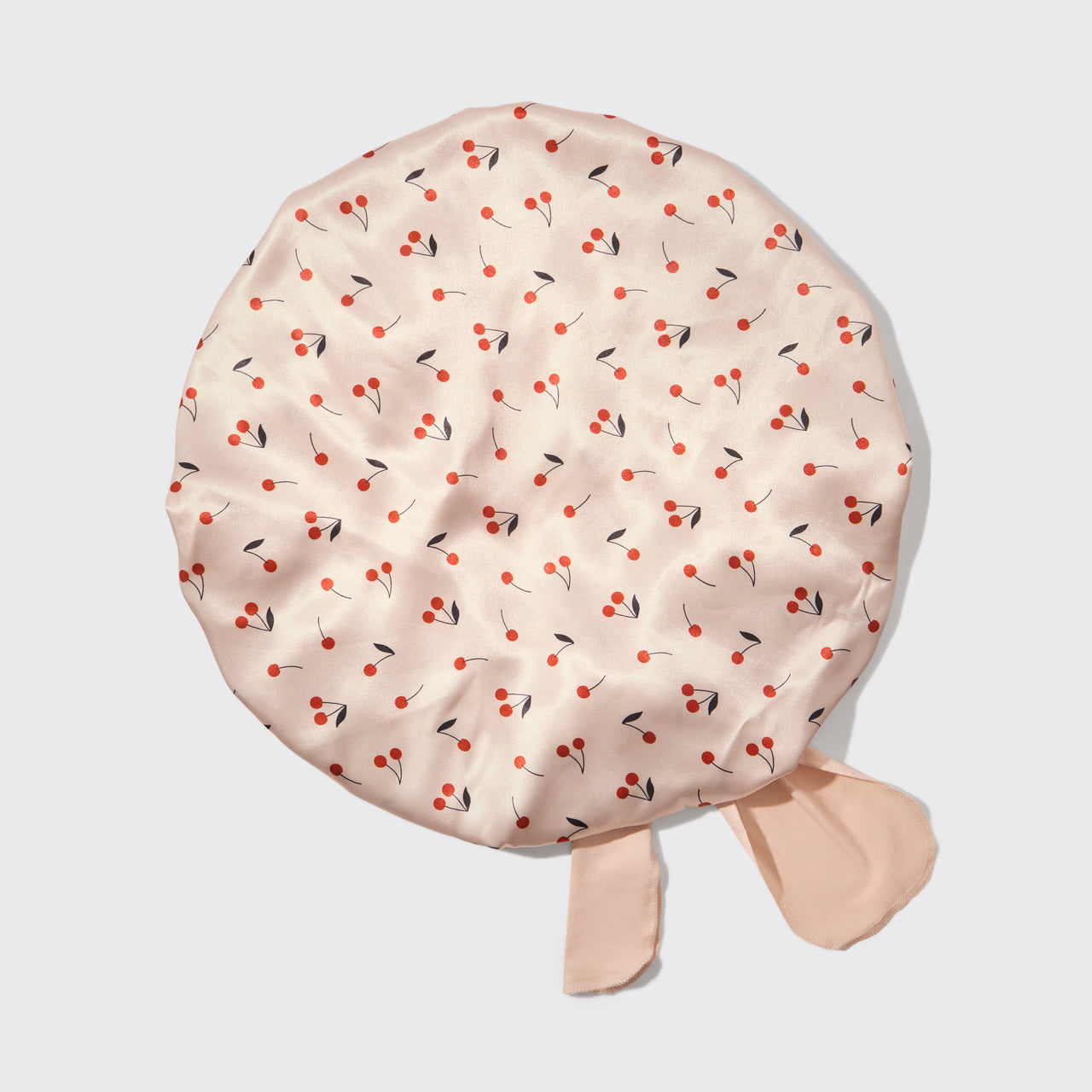 Over sized cherry printed bonnet on a white background
