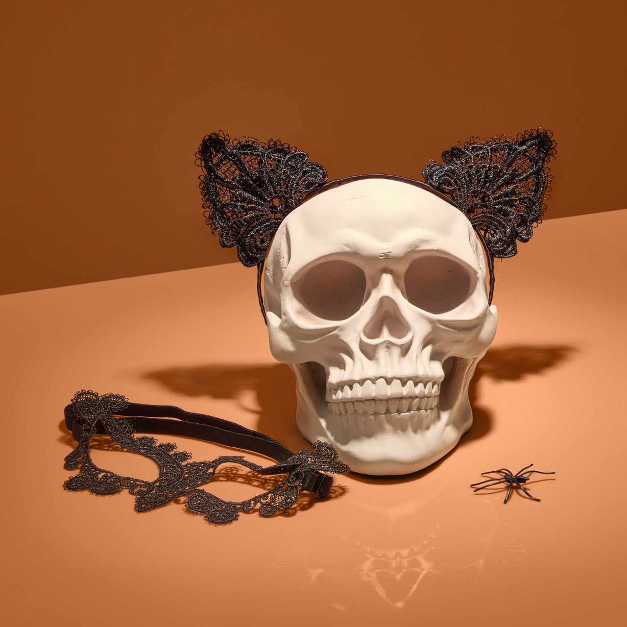 KITSCH Black Cat Lace Headband & Mask — creative product flat lay of black cat lace headband and mask — bold, mysterious Halloween accessory set