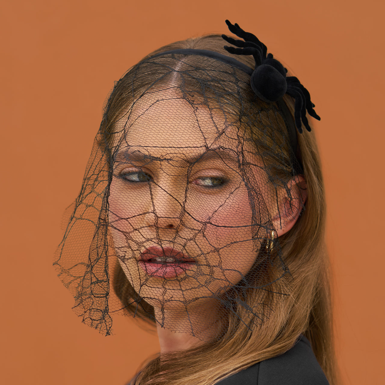 KITSCH Spiderweb Veil Headband — close-up of spiderweb veil headband worn on model — intricate lace spiderweb design for instant Halloween glam