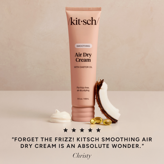 KITSCH Smoothing Air Dry Cream squeeze bottle on a creamy backdrop, showcasing the soft Kitsch Pink minimalist packaging and product label