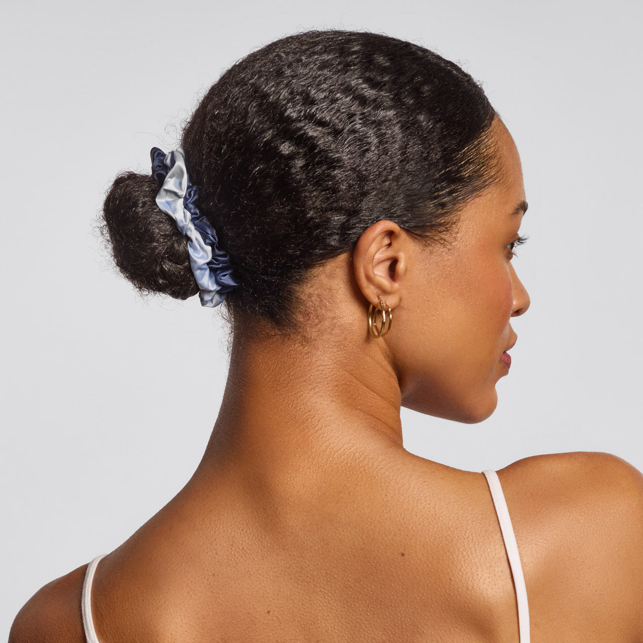 KITSCH Garden Bouquet Ruched Satin Scrunchies 5pc Set — lifestyle model shot with ruched satin garden bouquet scrunchies — silky satin won't snag or pull hair