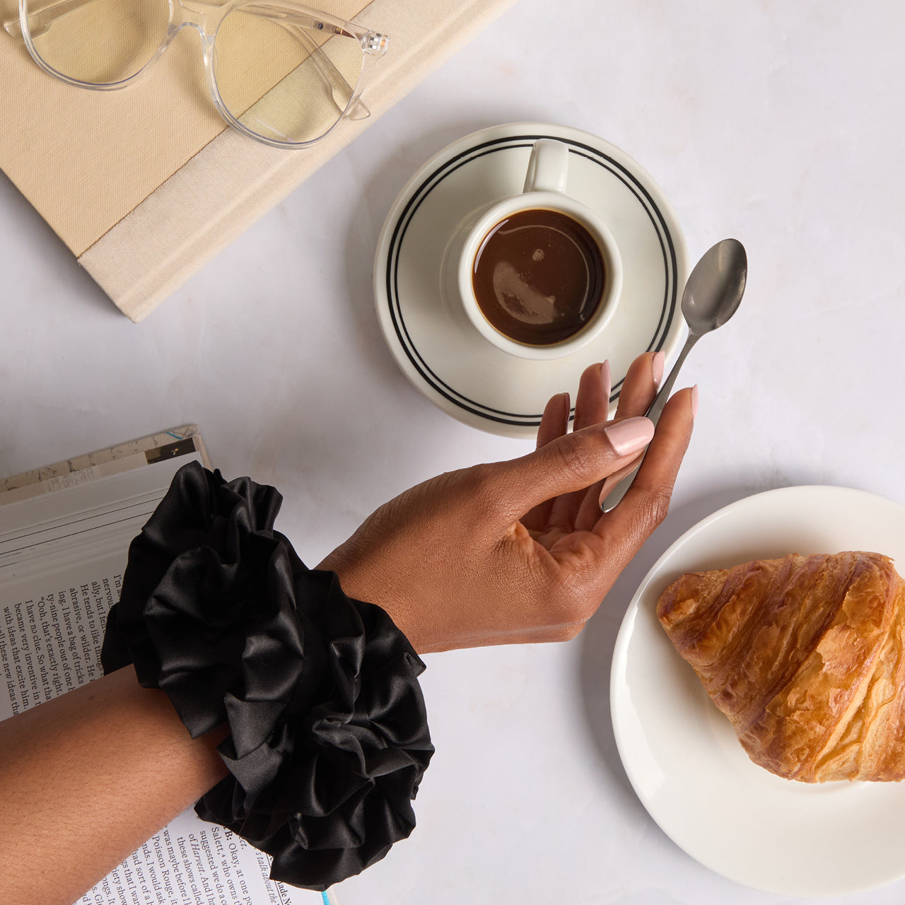 KITSCH Black Ruffle Scrunchie — model styling hair with black ruffle scrunchie — bold ruffle design for casual days, workouts, or photo-ready looks