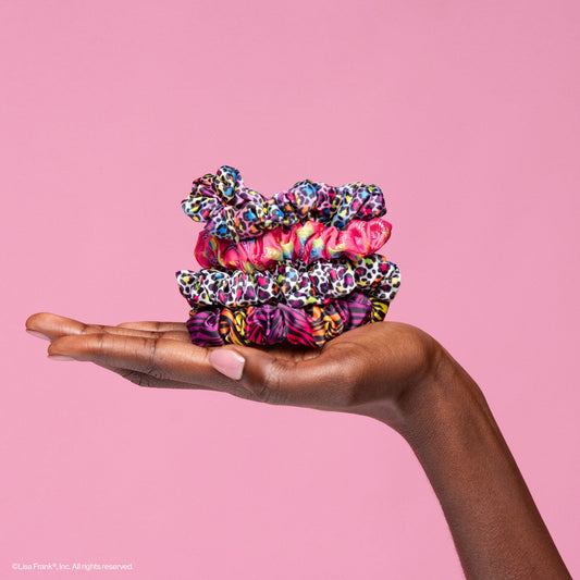 KITSCH Lisa Frank x Kitsch Ruched Satin Scrunchies in Rainbow Leopard — model wearing rainbow leopard ruched satin scrunchie — Lisa Frank x KITSCH collab, ruched design adds texture and volume