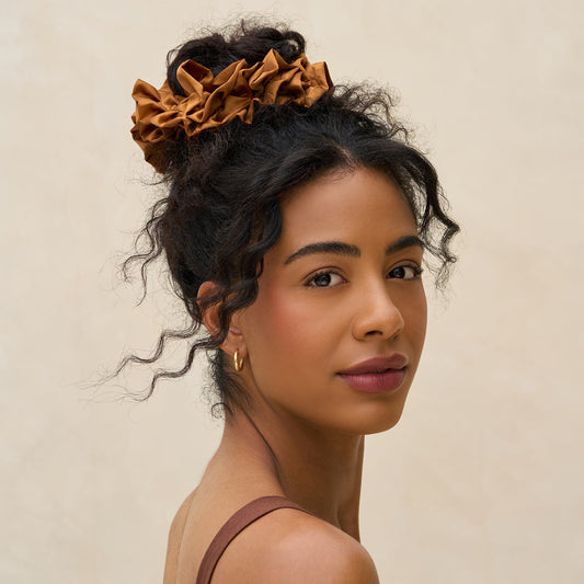 KITSCH Camel Ruffle Scrunchie — model wearing camel ruffle scrunchie — voluminous ruffle in warm camel tone adds playful texture and style