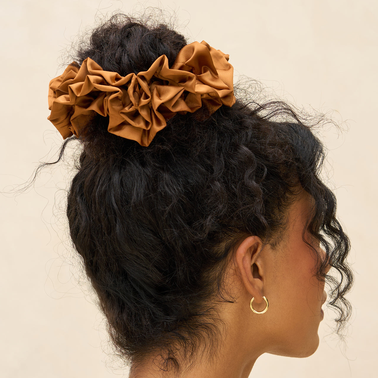 KITSCH Camel Ruffle Scrunchie — model styling hair with camel ruffle scrunchie — warm camel ruffle design for casual days, workouts, or photo-ready looks