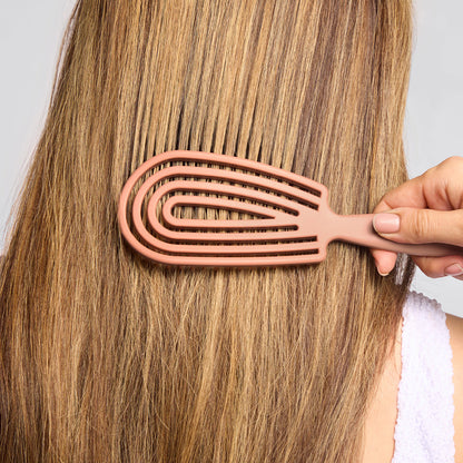 Close-up of Kitsch Terracotta Detangling Flexi Brush showing flexible silicone bristle base