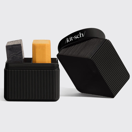 KITSCH 2-Compartment Travel Case Black — open case with solid shampoo and conditioner bars inside — KITSCH branding on case band — TSA-approved, eco-friendly recycled plastic construction