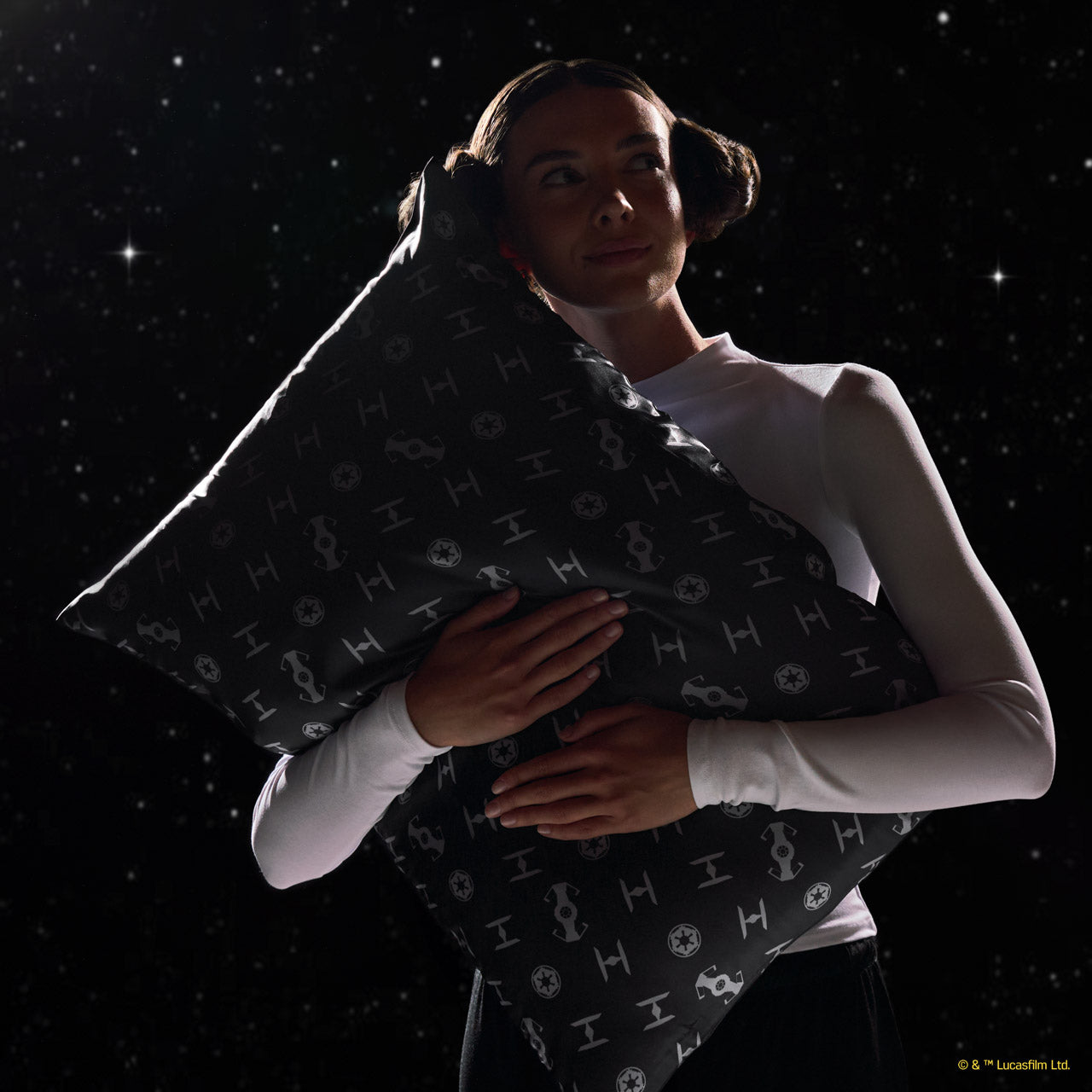 Model holding the Star Wars™ x Kitsch satin pillowcase against a dark background — Standard — lifestyle