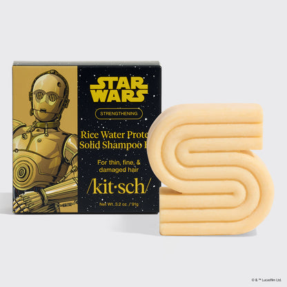 KITSCH x Star Wars™ Rice Water Protein Solid Shampoo Bar — C-3PO edition — STRENGTHENING formula For thin, fine, & damaged hair — honey-gold S-shaped solid shampoo bar beside gold and black Star Wars gift box featuring C-3PO artwork — /kit·sch/ — Net Wt. 3.2 oz / 90g