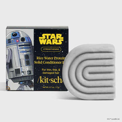 KITSCH x Star Wars™ Rice Water Protein Solid Conditioner Bar — R2-D2 edition — STRENGTHENING formula For thin, fine, & damaged hair — silver-grey S-shaped solid conditioner bar beside black and white Star Wars gift box featuring R2-D2 artwork — /kit·sch/ — Net Wt. 2.7 oz / 77g