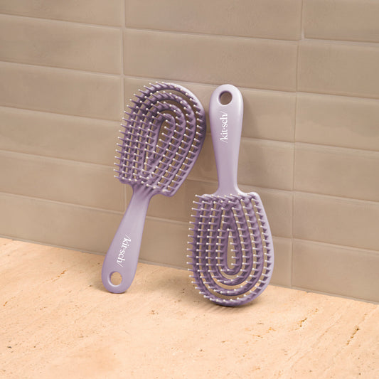 Kitsch Soft Violet Detangling Flexi Brush Mini side view showing flexible bristle base