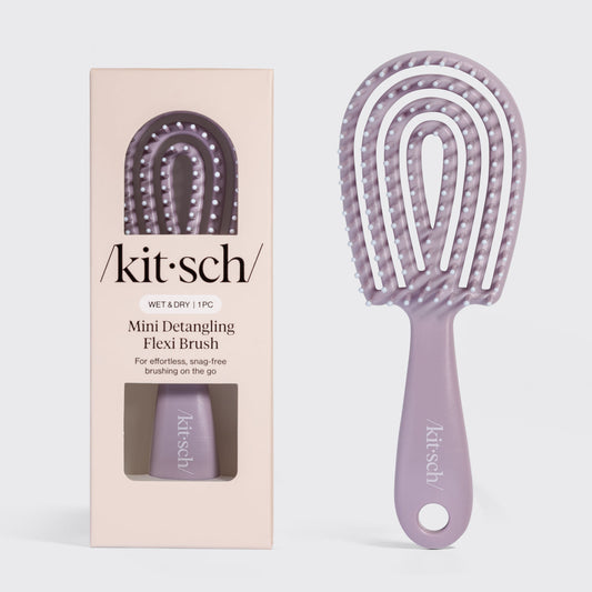 Soft Violet Kitsch Detangling Flexi Brush Mini on a soft neutral background