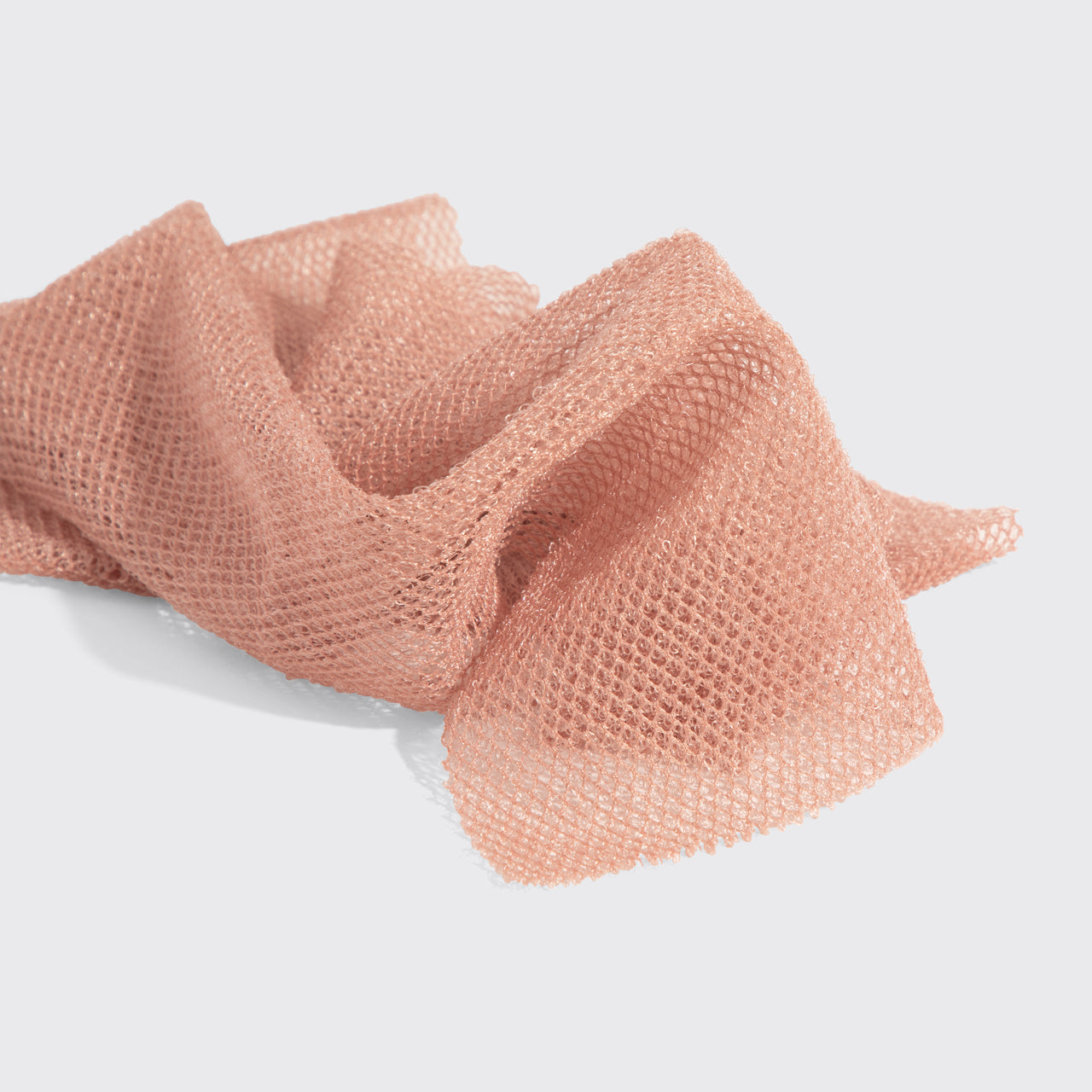 Close-up of rosewood mesh netting showing 100% recycled material
