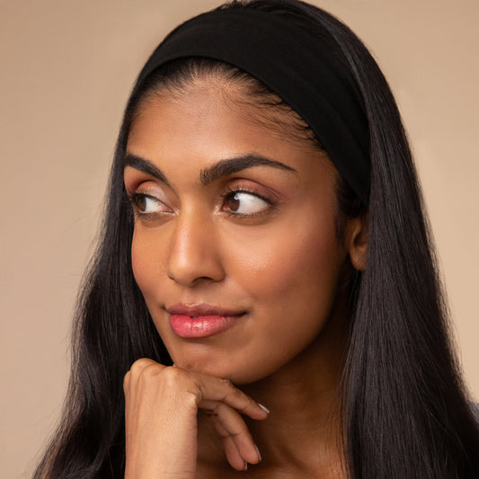KITSCH Black Active Headbands — model wearing black active headband during workout — keeps hair and flyaways out of face with a clean, polished finish