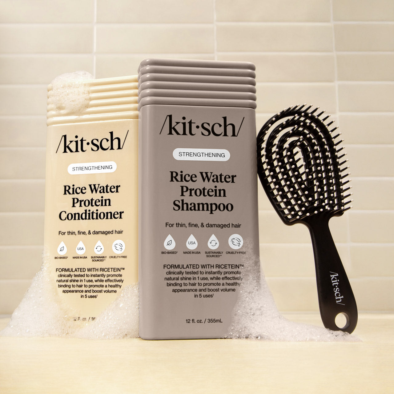 KITSCH Rice Water Protein Liquid Shampoo & Conditioner with Mini Detangling Flexi Brush — product trio flat lay — strengthens and smooths hair — part of the Ultimate Shower Bundle
