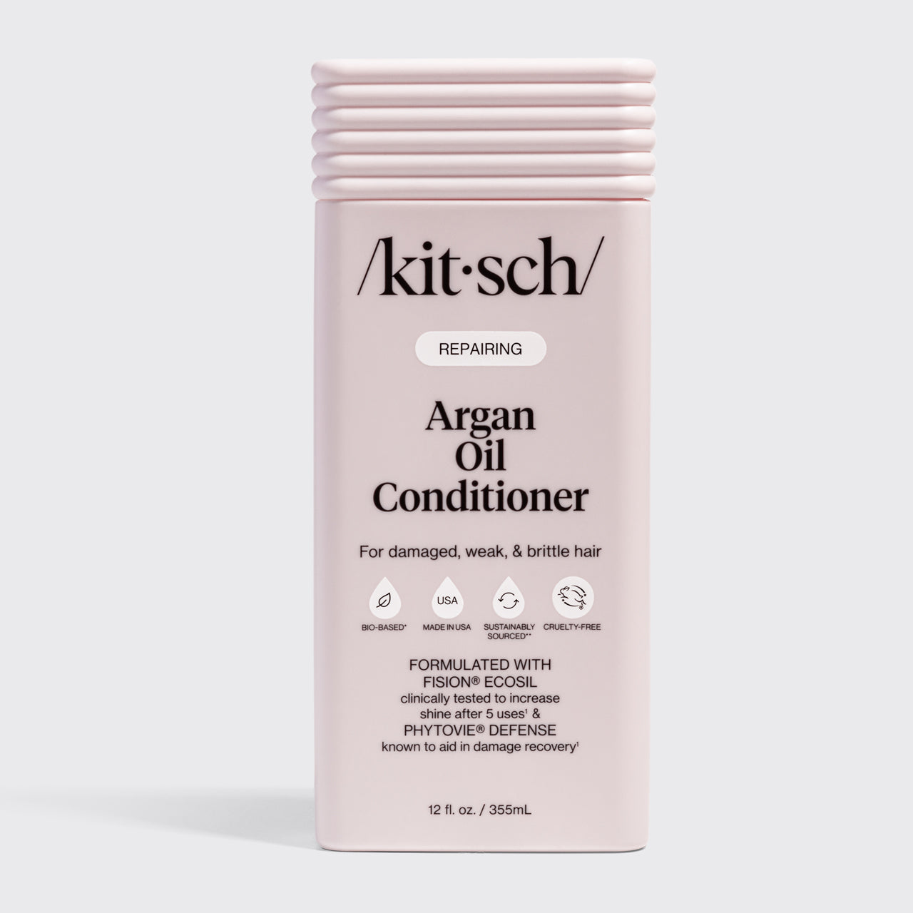 KITSCH Repairing Argan Oil Conditioner 12 fl. oz. — labeled REPAIRING, For damaged, weak, & brittle hair — icons: Bio-Based, Nontoxic, Sustainably Sourced, Cruelty-Free — Formulated with Fision® EcoSil clinically tested to increase shine after 5 uses & PhytoVie® Defense known to aid in damage recovery