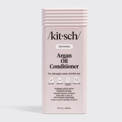 KITSCH Repairing Argan Oil Conditioner 12 fl. oz. — labeled REPAIRING, For damaged, weak, & brittle hair — icons: Bio-Based, Nontoxic, Sustainably Sourced, Cruelty-Free — Formulated with Fision® EcoSil clinically tested to increase shine after 5 uses & PhytoVie® Defense known to aid in damage recovery