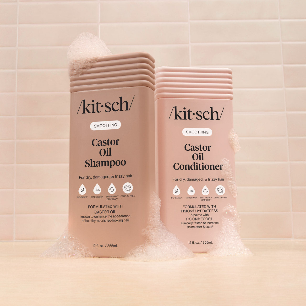 Kitsch Castor Oil Shampoo and Conditioner bottles on a beige background