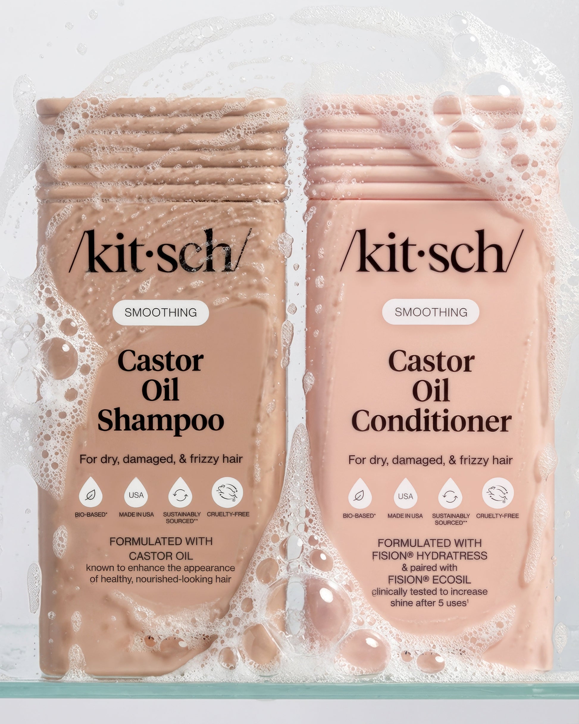 Two sudsy bottles of kitsch Castor Oil Shampoo and Conditioner on a white background