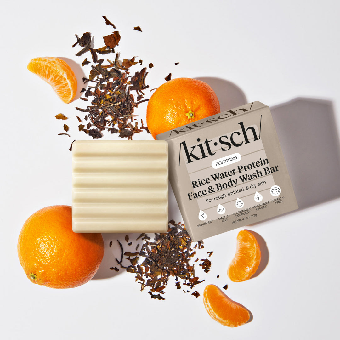 KITSCH Rice Water Protein Face & Body Wash Bar — lifestyle shot with botanical props