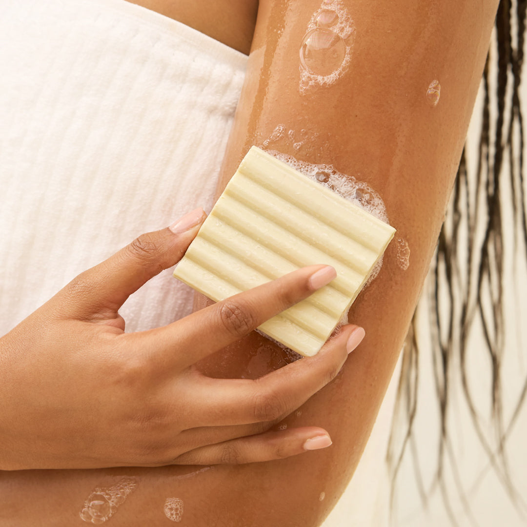 KITSCH Rice Water Protein Face & Body Wash Bar — model lathering bar in shower