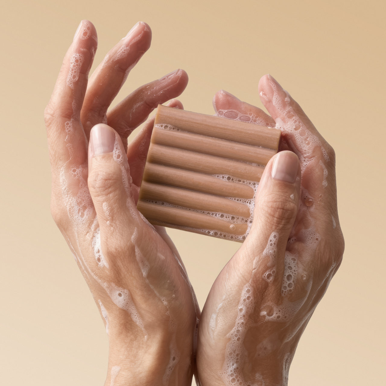 KITSCH Cleansing Warm Sugar Body Wash Bar — close-up of bar with rich sudsy lather — Sudsy lather for a soft, luxurious cleanse — easy-grip design features a ridged shape for better handling and application