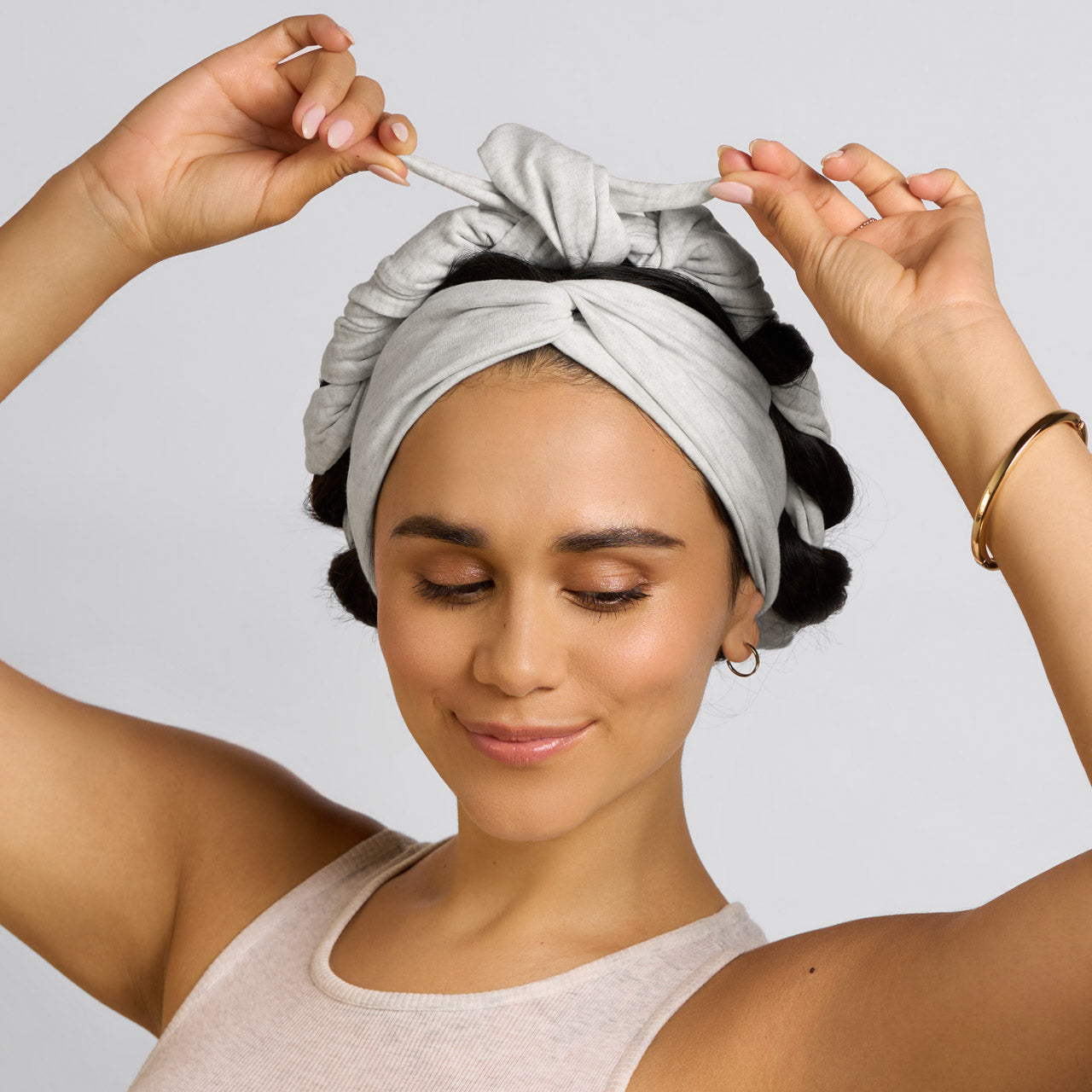 KITSCH Set & Flow Active Headband in Heather Gray — model wearing heather gray set & flow headband as a sleep style — wakes up to defined, frizz-free hair in the morning