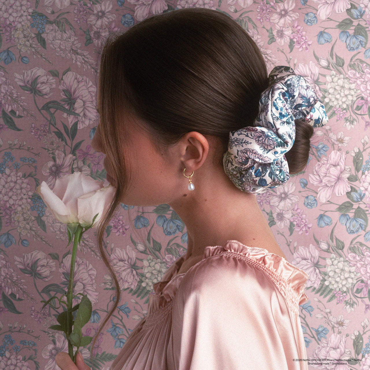 KITSCH Bridgerton x Kitsch Satin Pillow Scrunchies® in Toile in Bloom — model styling hair with Toile in Bloom pillow scrunchie — silky satin is gentle on hair, no creasing or breakage