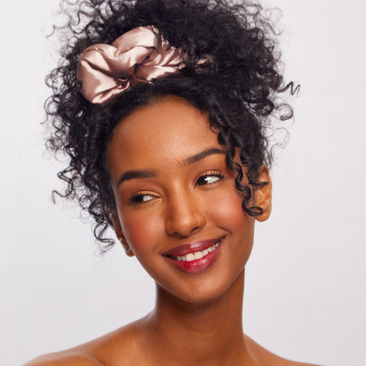 KITSCH Pillow Scrunchies® in Satin 4pc - Blush — model lifestyle — blush satin scrunchie styled in hair — soft enough to sleep in, cute enough to wear out