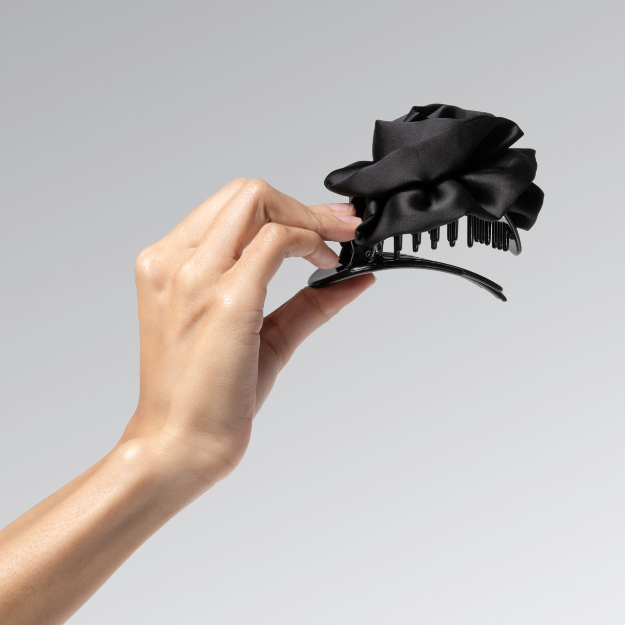 KITSCH Satin Rosette Flat Cloud Clip Black Medium — model hair shot