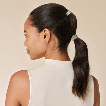 KITSCH Eucalyptus Hair Elastics 20pc Set — model wearing hair elastic — Soft and stretchy design gives a tight, all-day hold — effortlessly glides through hair without tugging or snagging to help prevent breakage