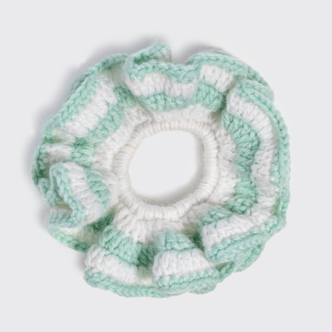 KITSCH Coastal Cottage Crochet Scrunchie in sage green and white, flat lay overhead view showing textured crochet detail