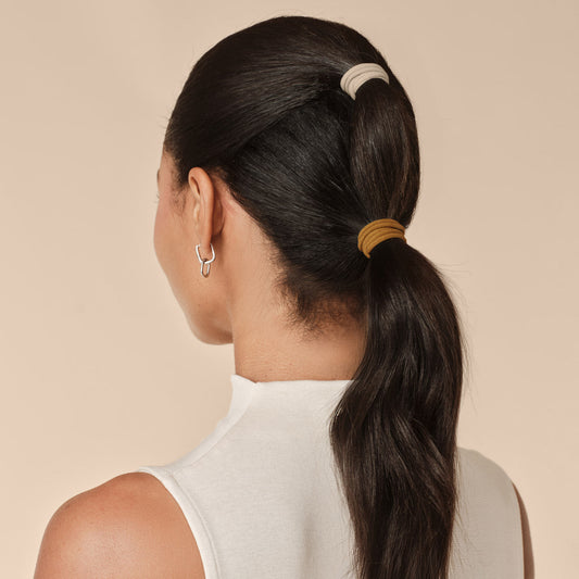 Sedona Seamless Hair Elastics 12pc Set - model from behind with low ponytail secured with sedona seamless hair ties