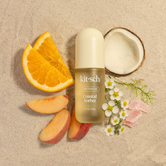 Kitsch Coastal Sorbet Hair Perfume surrounded by passion fruit, peach, mango scent ingredients