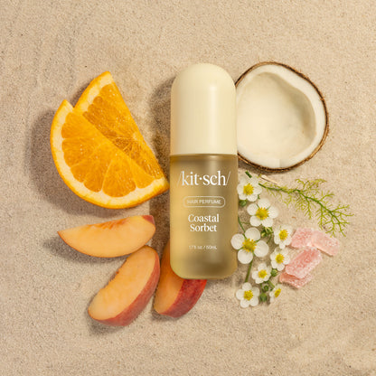 Kitsch Coastal Sorbet Hair Perfume surrounded by passion fruit, peach, mango scent ingredients